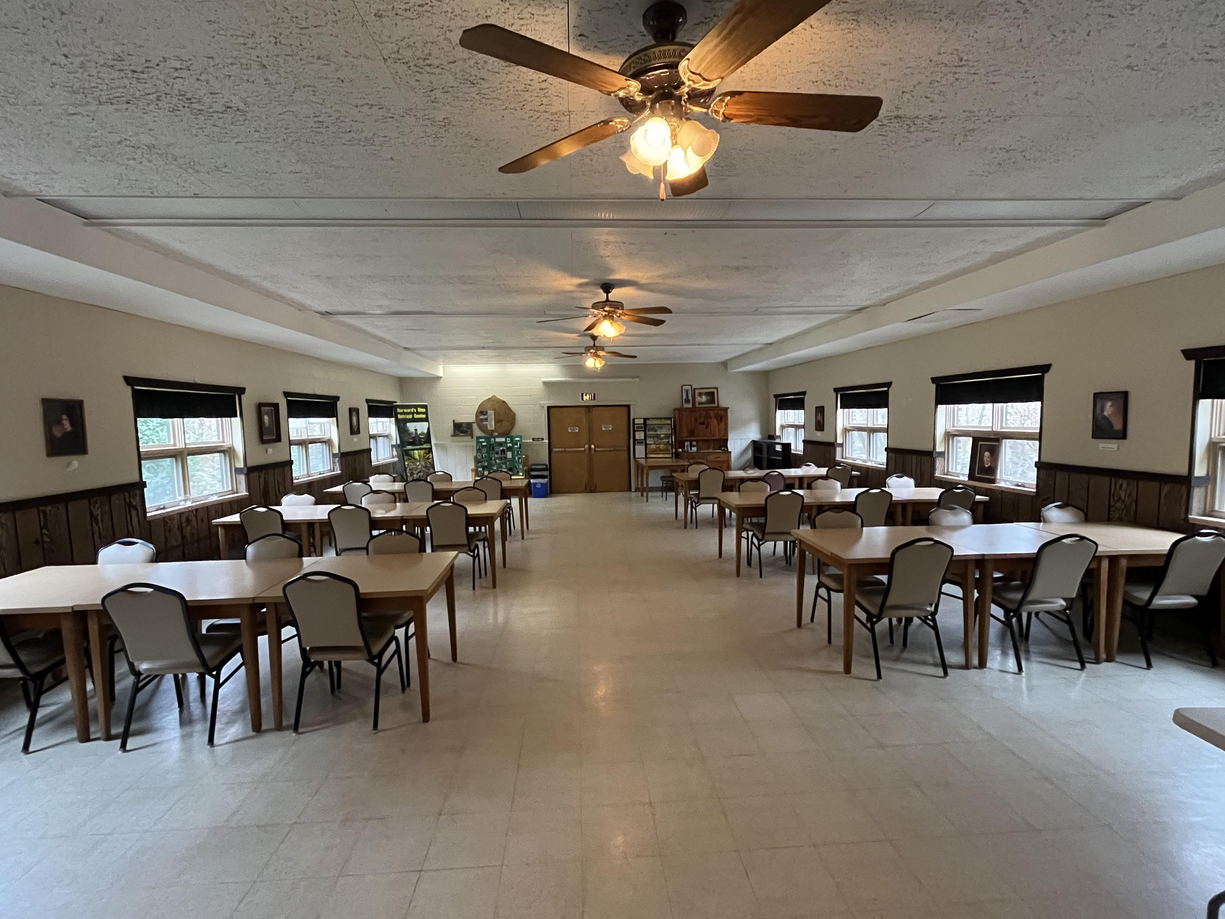 Main Hall dining room with tables set for retreat gathering